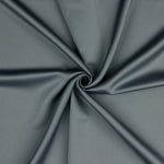 A beautiful soft polyester satin that has a subtle sateen sheen rather than a high gloss finish usually associated with satins. Because of this it has a high-end expensive look. Perfect for evening wear and day wear alike! This being the classic grey colourway.  Sold in half meter lengths at Fabric Focus.
