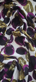   'Pebbles' polyester jersey in purple and green on an ivory background. Portia Jersey is a soft handle, slinky jersey, perfect for dresses skirts and tops.   Colours may vary due to differences in computer settings. Sold in half metre increments at Fabric Focus.