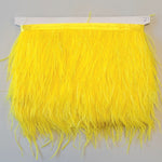 Super Luxurious Ostrich Feather trim, coloured and on co-ordinating coloured ribbon. Great for dressmaking, crafting, home decor and costume. A fashionable bright yellow colour-way on a co-ordinating ribbon. Sold in metre increments