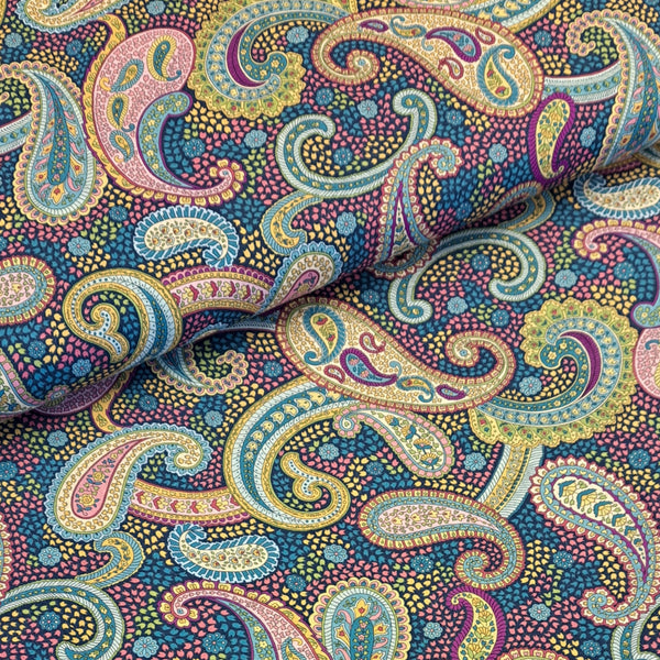 Beautiful colourful paisley shapes on a dark navy background.  Perfect from shirts, tops, dresses and PJs. Available in half metre increments at Fabric Focus. Colours may vary due to differences in computer settings. 