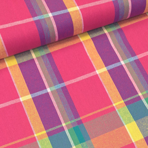 Stunning, large scale cotton madras cotton in bold and vibrant coloured check! Perfect for shirts and dresses. Bold yellow, purple and green on a bright cerise pink background. Sold in half metre increments at Fabric Focus Edinburgh.