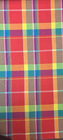 Stunning, large scale cotton madras cotton in bold and vibrant coloured check! Perfect for shirts and dresses. Bold lime, turquoise and purple on a bright red background. Sold in half metre increments at Fabric Focus Edinburgh.