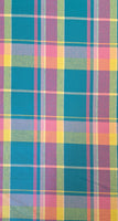 Stunning, large scale cotton madras cotton in bold and vibrant coloured check! Perfect for shirts and dresses. Bold yellow, and pink on a bright turquoise background. Sold in half metre increments at Fabric Focus Edinburgh.