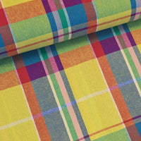Stunning, large scale cotton madras cotton in bold and vibrant coloured check! Perfect for shirts and dresses. Bold red, turquoise and purple on a bright yellow background. Sold in half metre increments at Fabric Focus Edinburgh.