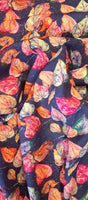 A wonderful medium dressmaking weight linen. Linen mixed with natural viscose. A digital print of multicoloured leaves on a french navy background.  Available to buy in metre increments from Fabric Focus Edinburgh. 