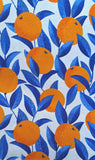 A wonderful medium dressmaking weight linen. Linen mixed with natural viscose. A digital print of zesty oranges with cobalt blue leaves on an off white background.  Available to buy in metre increments from Fabric Focus Edinburgh. 