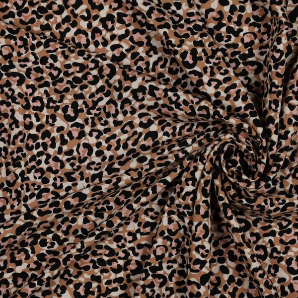 A beautiful animal print of pale pink, ivory and black spots on an tan background. Perfect for wrap dresses, wide legged trousers and blouses. Manufacturer recommends 30 degree wash but please allow for shrinkage and test a piece before hand.  Sold in half metre increments at Fabric Focus Edinburgh.