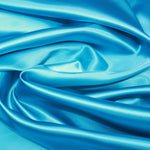 A great satin for evening wear or as a luxurious lining to a coat or jacket. Comes in various beautiful shades. This being the rich Peacock. Dry Clean Only NOTE - This fabric will mark if in contact with water Use a dry iron when pressing Available to buy online in half metre increments at Fabric Focus Edinburgh.
