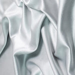 Satin Backed Crepe is a beautiful fabric for draping and is truly reversible. Satin and matt complements each other and both sides can be used in the same garment. Prada, satin back crepe is available in many beautiful colours, this being the delicate Silver grey.  Sold in half meter lengths at Fabric Focus.