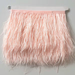 Ostrich feather trim in a soft pale pink colour way available to buy in store and online at Fabric Focus edinburgh.