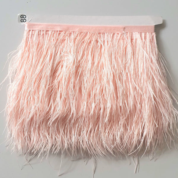 Ostrich feather trim in a soft pale pink colour way available to buy in store and online at Fabric Focus edinburgh.