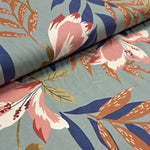 tropical print of leaves and flowers in rose pink, navy and brown on a sage green background in a super soft 100% viscose.