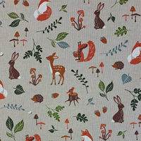 Forest Animals scattered over a neutral background. Showcasing foxes, deer, rabbits, squirrels and birds.  A printed half panama European produced fabric, it is Cotton Rich and is also referred to as a canvas by some. Widely used for Bag Making, Apparel and Crafting. Available in half metre increments at Fabric Focus.