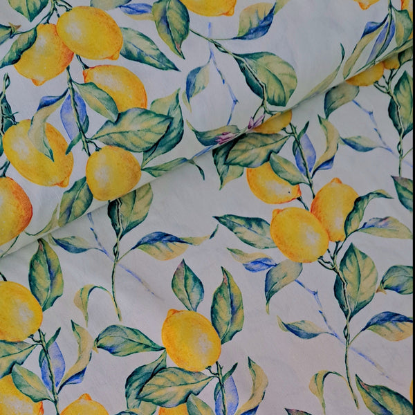 Fresh and zesty cotton print with bright lemons and leaves on the palest cream background! Perfect for easy breezy Spring/Summer dresses!  Sold in half metre increments at Fabric Focus.