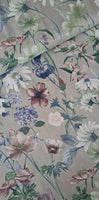Beautifully depicted flowers and leaves in soft tones of green, grey, copper and white on a soft lilac grey background! Perfect for Spring/Summer dresses! Sold in half metre increments at Fabric Focus.