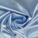 A great satin for evening wear or as a luxurious lining to a coat or jacket. Comes in various beautiful shades. This being the delicate baby blue. Dry Clean Only NOTE - This fabric will mark if in contact with water Use a dry iron when pressing Available to buy online in half metre increments at Fabric Focus Edinburgh.