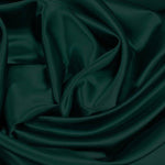 A great satin for evening wear or as a luxurious lining to a coat or jacket. Comes in various beautiful shades. This being the classic bottle green. Dry Clean Only NOTE - This fabric will mark if in contact with water Use a dry iron when pressing Available to buy online in half metre increments at Fabric Focus Edinburgh.