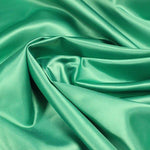 A great satin for evening wear or as a luxurious lining to a coat or jacket. Comes in various beautiful shades. This being the jewel tone emerald. Dry Clean Only NOTE - This fabric will mark if in contact with water Use a dry iron when pressing Available to buy online in half metre increments at Fabric Focus Edinburgh.