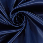 A great satin for evening wear or as a luxurious lining to a coat or jacket. Comes in various beautiful shades. This being the classic navy blue. Dry Clean Only NOTE - This fabric will mark if in contact with water Use a dry iron when pressing Available to buy online in half metre increments at Fabric Focus Edinburgh.