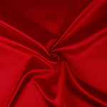 A great satin for evening wear or as a luxurious lining to a coat or jacket. Comes in various beautiful shades. This being the vibrant red. Dry Clean Only NOTE - This fabric will mark if in contact with water Use a dry iron when pressing Available to buy online in half metre increments at Fabric Focus Edinburgh.