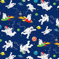 Blast Off Into Space 100% cotton range showing suited astronauts floating in space and riding rocket ships on a navy blue background. Available to buy in store and online at Fabric Focus Edinburgh.