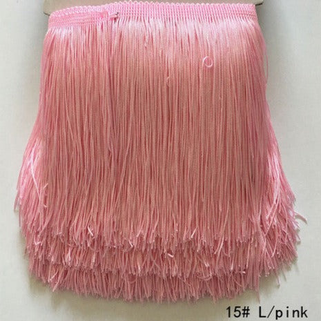 polyester fringing in pale pink. 15cm deep. Available to buy in store and online at Fabric Focus Edinburgh