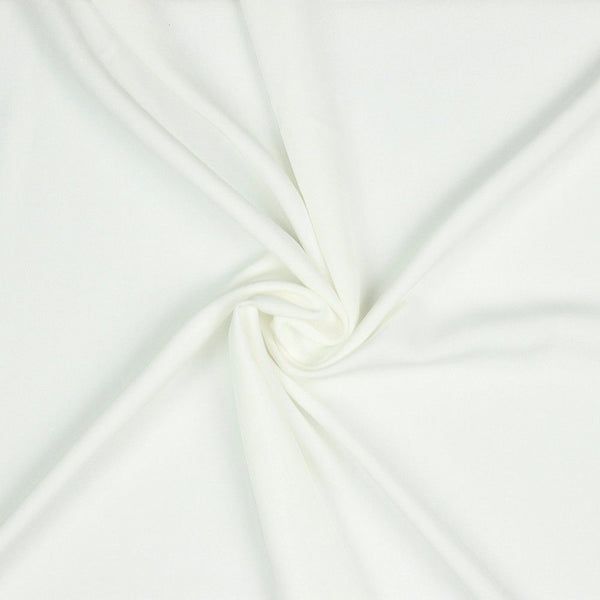 A beautiful plain viscose fabric in a stunning classic ivory colour. perfect for wrap dresses, wide legged trousers and blouses. Mix with printed viscose for a great summer ensemble. Available to buy in half metre increments at Fabric Focus.
