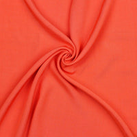 A beautiful plain viscose fabric in a stunning summery coral colour. perfect for wrap dresses, wide legged trousers and blouses. Mix with printed viscose for a great summer ensemble. Available to buy in half metre increments at Fabric Focus.