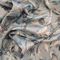 Pale sky blue background with blue and silver eucalyptus leaves make up this beautiful soft satin with amazing drape. Available to buy in half metre increments at Fabric Focus