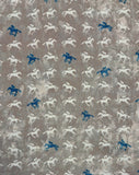 A beautiful print of ivory and blue horses with jockeys on a distressed taupe background. Perfect for wrap dresses, wide legged trousers and blouses. Manufacturer recommends 30 degree wash but please allow for shrinkage and test a piece before hand.  Sold in half metre increments at Fabric Focus Edinburgh.