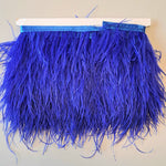 Super Luxurious Ostrich Feather trim, coloured and on co-ordinating coloured ribbon. Great for dressmaking, crafting, home decor and costume. A fashionable royal blue colour-way on a co-ordinating ribbon. Sold in metre increments