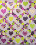 A vibrant quilt kit of trellis and heart shapes using the bright and fun collection of fabrics from Robin Pickens called Pansies Posies. Available at Fabric Focus Edinburgh.