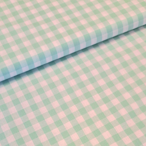 Incredibly versatile, our yarn-dyed* 100% cotton gingham fabric is ideal as a dress fabric and eternally popular for school uniforms, tablecloths, bunting, curtains, aprons, cushions, craft projects, Christmas decorations and much, much more. This being the fresh mint green colourway. Available to buy at Fabric Focus.