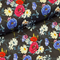  This beautiful stretch cotton fabric is a fantastic to sew with. The the ease of sewing with cotton, but the spandex content means this fabric has a one way stretch.  A striking print of daisies roses and poppies on a dark almost black navy background. Sold in half metre increments online and in store at Fabric Focus.