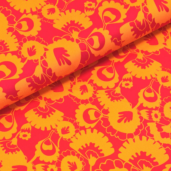  This beautiful stretch cotton fabric is a fantastic to sew with. The the ease of sewing with cotton, but the spandex content means this fabric has a one way stretch.  A striking funky retro 60s print of orange and fuchsia pink stylised flowers. Sold in half metre increments online and in store at Fabric Focus.