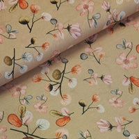 A lovely print of flowers and leaves in soft pastel pinks, grey, browns and oranges on a soft gold background. Printed on a beautiful lightweight cotton lawn, perfect for Spring/Summer dresses! Sold in half metre increments at Fabric Focus.