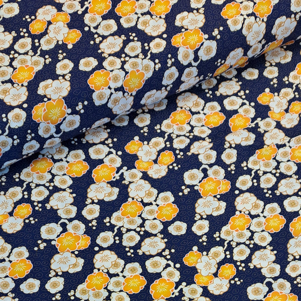 A beautiful print in a Japanese motif style called Ume, yellow and white blossom on a navy background on a soft viscose fabric. Perfect for wrap dresses, wide legged trousers and blouses.
 Sold in half metre increments at Fabric Focus Edinburgh.