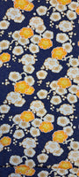 A beautiful print in a Japanese motif style called Ume, yellow and white blossom on a navy background on a soft viscose fabric. Perfect for wrap dresses, wide legged trousers and blouses.
 Sold in half metre increments at Fabric Focus Edinburgh.