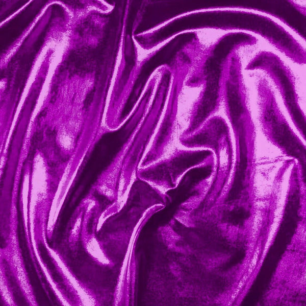 Bright metallic foil on a stretch jersey base cloth - perfect for fashion, costume and crafts . Metallic purple colourway. Available at Fabric Focus Edinburgh.