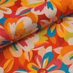 Gorgeous viscose floral print in reds, oranges and turquoise. Wonderful for dressmaking, tops, skirts and wide leg trousers. Available to buy online at fabric Focus in half metre increments.