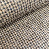 Close-up of checkered fabric with blue and beige pattern