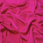 Beautiful self coloured crepe with great drape in a rich lipstick pink.  Suitable for day and evening wear alike. 100% Polyester. Sold in half meter lengths.