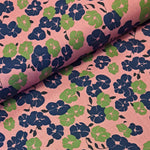 Cotton Print perfect for making shirts, dresses, lightweight trousers and skirts. Floral print of navy and green on a deep blush background Sold @ Fabric Focus.