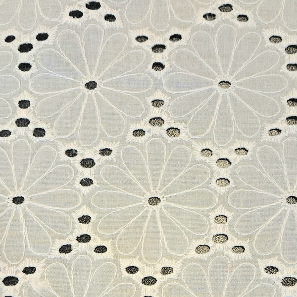 Off White cotton embroidered eyelet daisy broderie anglais. Stunning summer dress or skirt! Available to buy at Fabric Focus Edinburgh.