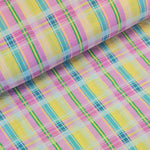 Beautiful cotton lycra mix seersucker in a summer check plaid of pink, turquoise, green and yellow. Available to buy at Fabric Focus Edinburgh.