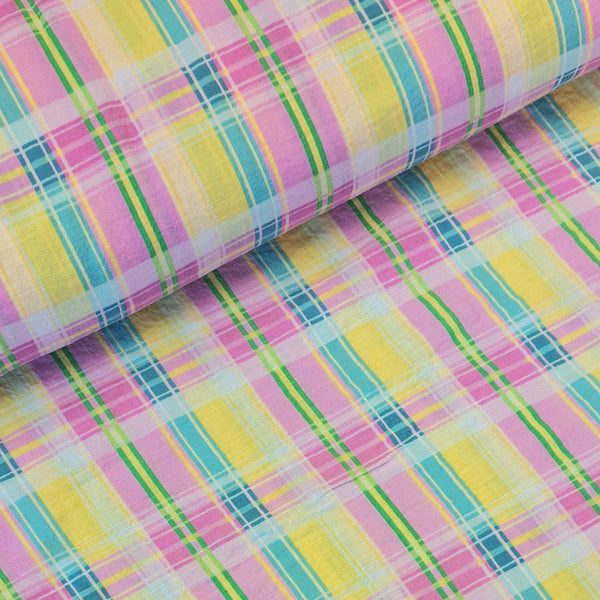 Beautiful cotton lycra mix seersucker in a summer check plaid of pink, turquoise, green and yellow. Available to buy at Fabric Focus Edinburgh.