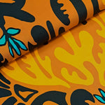 Beautiful terracotta cotton in a over-sized tribal print picked out in black, orange and turquoise. Very Striking! Available to buy at Fabric Focus Edinburgh.