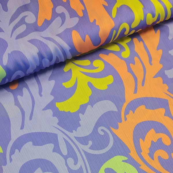 Polyester with lilac background and gold and orange oversized 'plumes'. Available to buy in half metre increments at Fabric Focus.