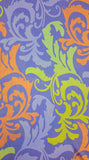 Polyester with lilac background and gold and orange oversized 'plumes'. Available to buy in half metre increments at Fabric Focus.
