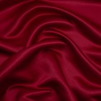 Duchess Satin fabric is a highly lustrous, smooth, very finely woven heavy non stretch satin.  This is the classic burgundy colourway. Sold at Fabric Focus.